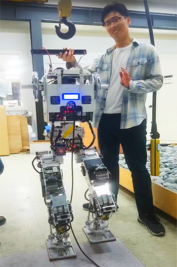 Lee with Hubo, a humanoid robot created at Korea Advanced Institute of Science and Technology.