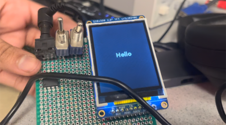 A computer screen says "Hello"