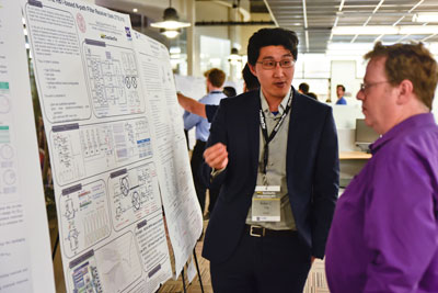 Robin Ying presents a poster on developments in flexible receiver front ends for "6G radio"